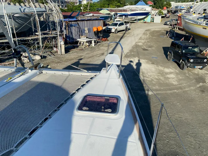 Eugenite Yacht Photos Pics Lagoon 380 catamaran on land, showing deck and surrounding boatyard, 2013 model.