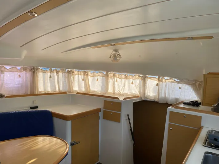 Eugenite Yacht Photos Pics Interior of 2013 Lagoon 380 catamaran with cozy seating and natural light.