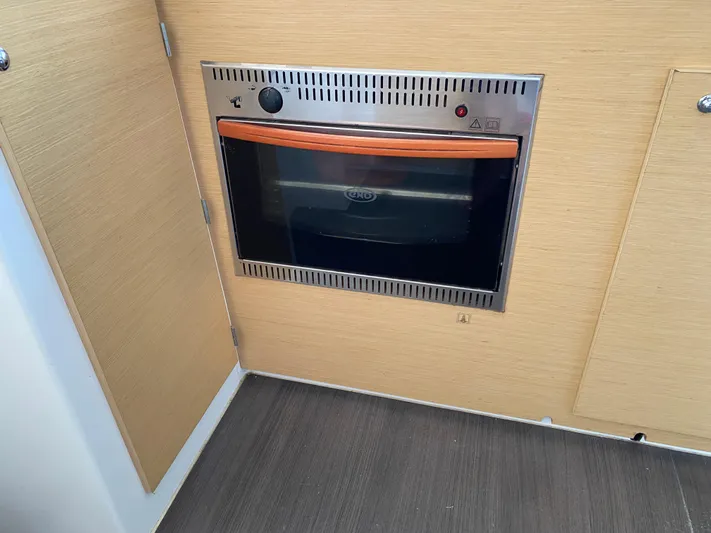 Eugenite Yacht Photos Pics Built-in oven in Lagoon 380 yacht kitchen, 2013 model, with wooden cabinetry.