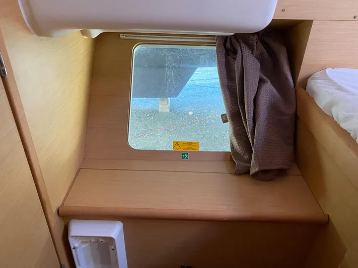 Eugenite Yacht Photos Pics Interior cabin window of a 2013 Lagoon 380 catamaran with curtain partially drawn.
