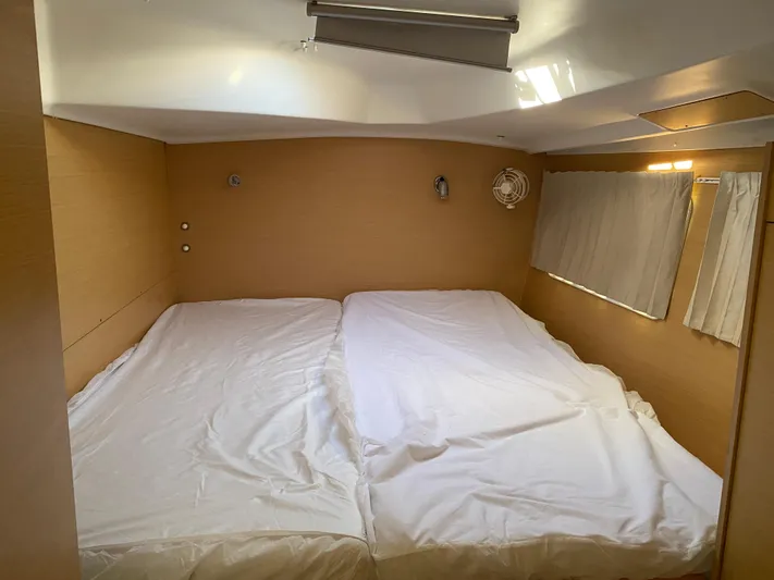 Eugenite Yacht Photos Pics 2013 Lagoon 380 cabin interior with twin beds and wooden paneling.