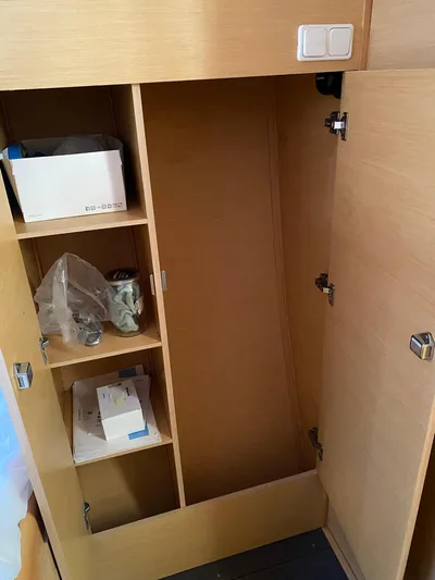 Eugenite Yacht Photos Pics Wooden storage cabinet with shelves inside a 2013 Lagoon 380 model.