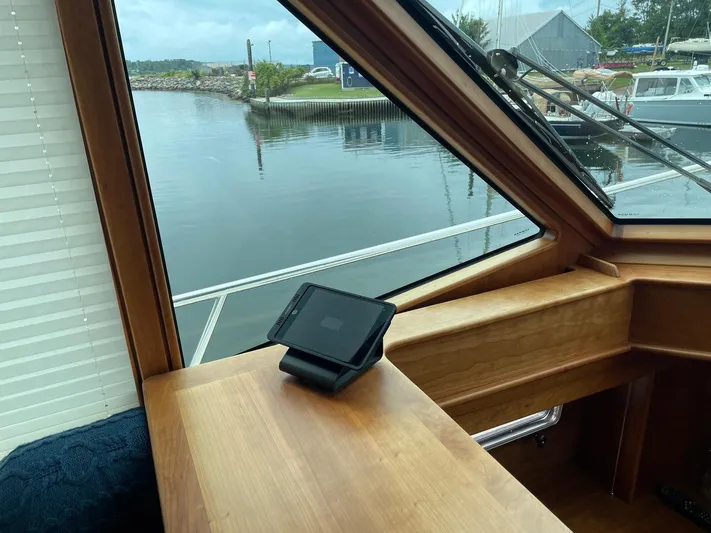 Last Resort Yacht Photos Pics Interior view of 2021 Sabre 58 Salon Express yacht, showcasing wooden dashboard and waterway.