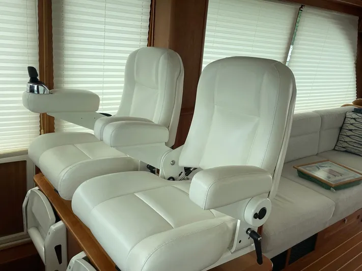 Last Resort Yacht Photos Pics Luxurious white leather seats inside a 2021 Sabre 58 Salon Express yacht.