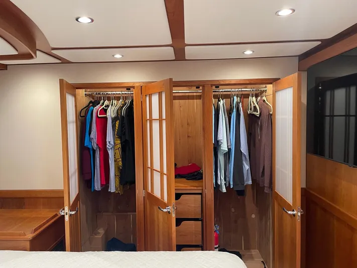 Last Resort Yacht Photos Pics Spacious wooden closet in 2021 Sabre 58 Salon Express yacht bedroom.