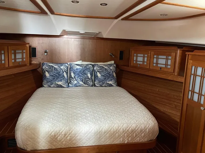 Last Resort Yacht Photos Pics Luxurious cabin interior of 2021 Sabre 58 Salon Express yacht with cozy bedding.