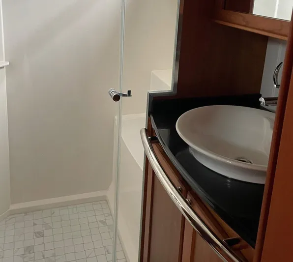 Last Resort Yacht Photos Pics Bathroom interior of 2021 Sabre 58 Salon Express yacht with modern sink and shower.