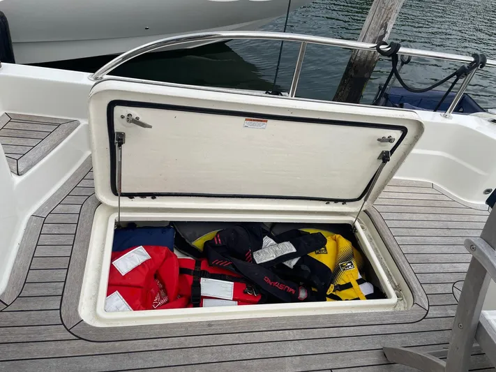 Last Resort Yacht Photos Pics Open storage compartment on 2021 Sabre 58 Salon Express with life jackets inside.