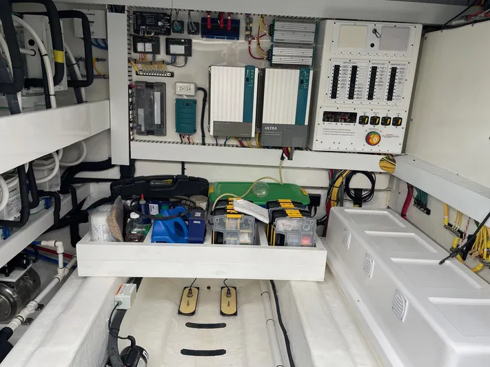 Last Resort Yacht Photos Pics Engine room of 2021 Sabre 58 Salon Express, showcasing electrical panels and equipment.