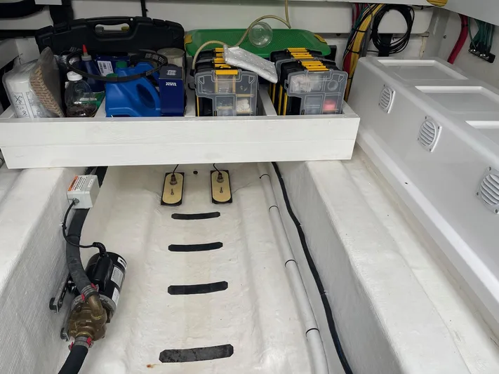 Last Resort Yacht Photos Pics 2021 Sabre 58 Salon Express engine room with organized tools and equipment storage.