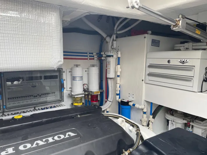 Last Resort Yacht Photos Pics Engine room of 2021 Sabre 58 Salon Express with Volvo components and organized piping system.