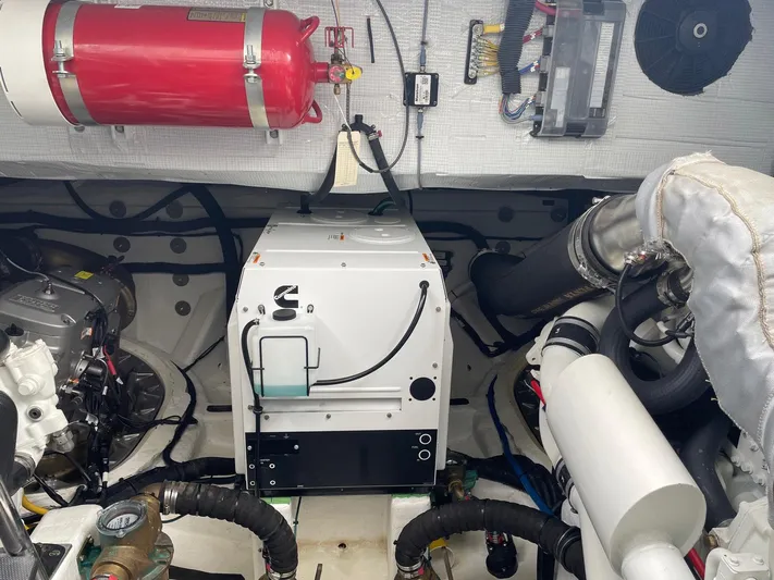 Last Resort Yacht Photos Pics Engine room of 2021 Sabre 58 Salon Express with fire extinguisher and machinery.