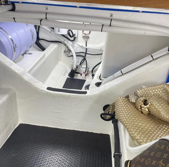 Last Resort Yacht Photos Pics 2021 Sabre 58 Salon Express interior with visible wiring and storage area.