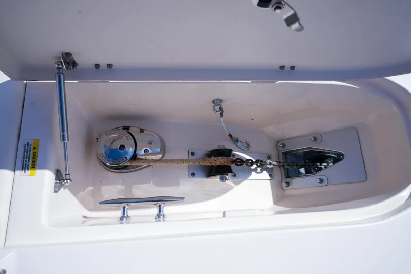  Yacht Photos Pics Anchor locker of 2014 Grady-White Freedom 307 boat, featuring chain and windlass system.