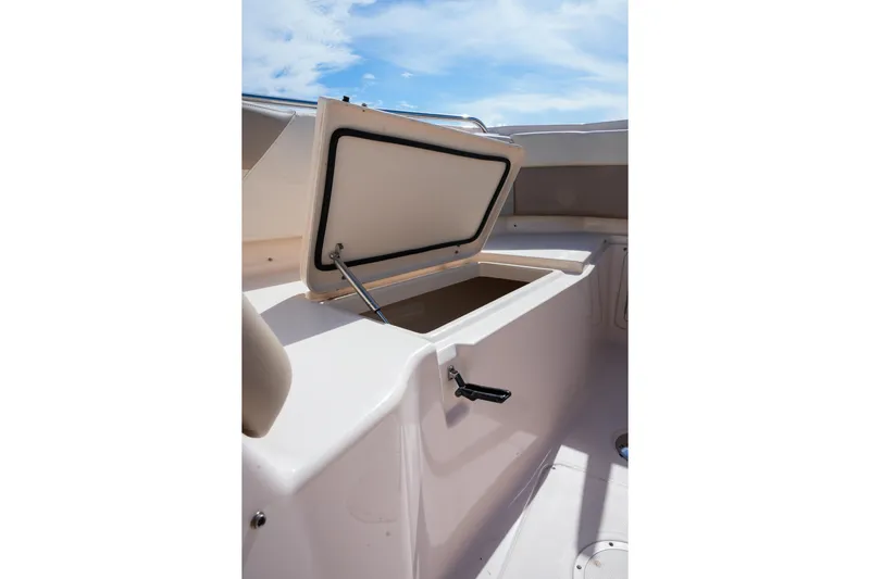  Yacht Photos Pics Open storage compartment on 2014 Grady-White Freedom 307 boat under a clear sky.