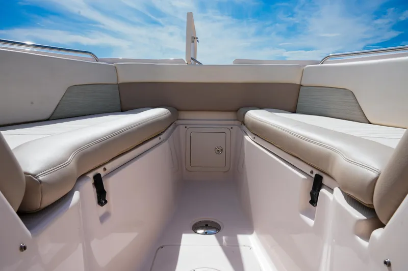  Yacht Photos Pics 2014 Grady-White Freedom 307 boat interior with cushioned seating under blue sky.