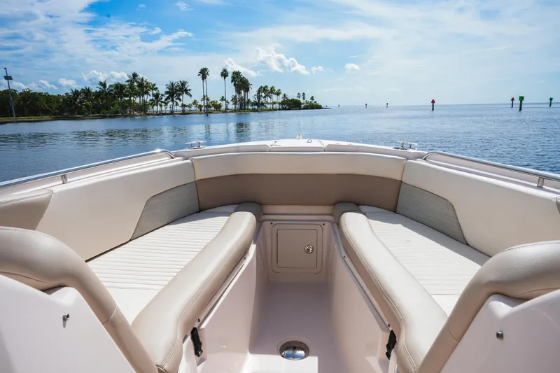  Yacht Photos Pics 2014 Grady-White Freedom 307 boat interior with scenic ocean view and palm trees.
