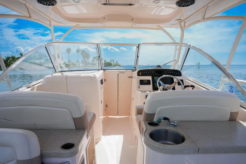  Yacht Photos Pics 2014 Grady-White Freedom 307 boat interior with helm, seating, and ocean view.