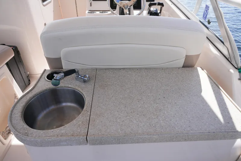 Yacht Photos Pics 2014 Grady-White Freedom 307 boat interior with sink and countertop.