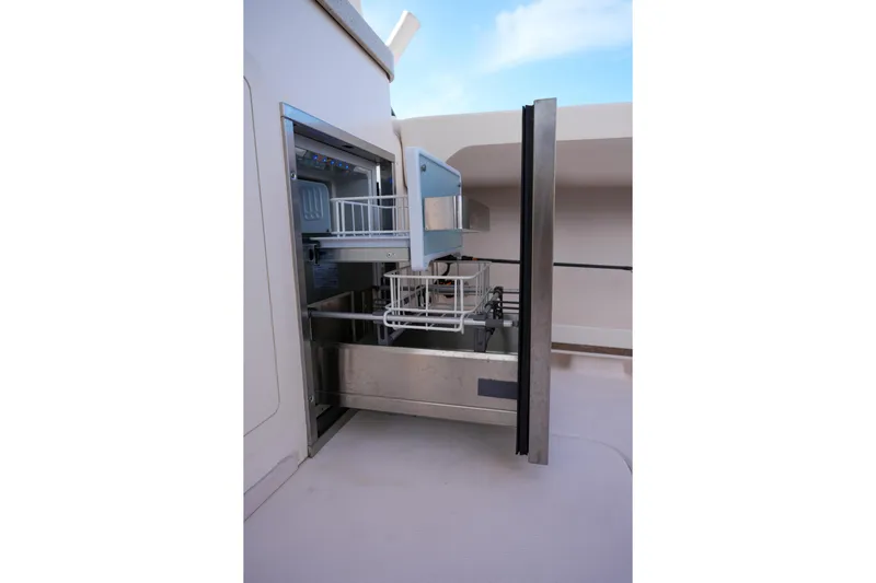  Yacht Photos Pics 2014 Grady-White Freedom 307 boat with open storage compartment.