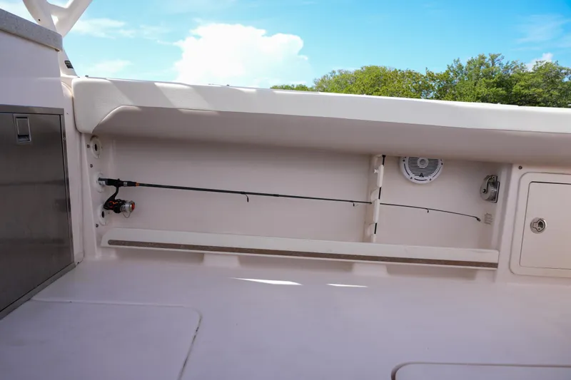  Yacht Photos Pics 2014 Grady-White Freedom 307 boat interior with fishing rod storage and speaker.