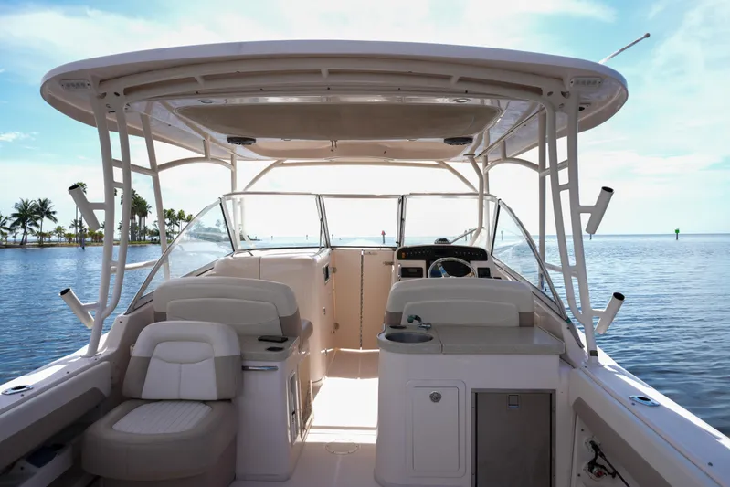  Yacht Photos Pics 2014 Grady-White Freedom 307 boat interior with helm, seating, and ocean view.