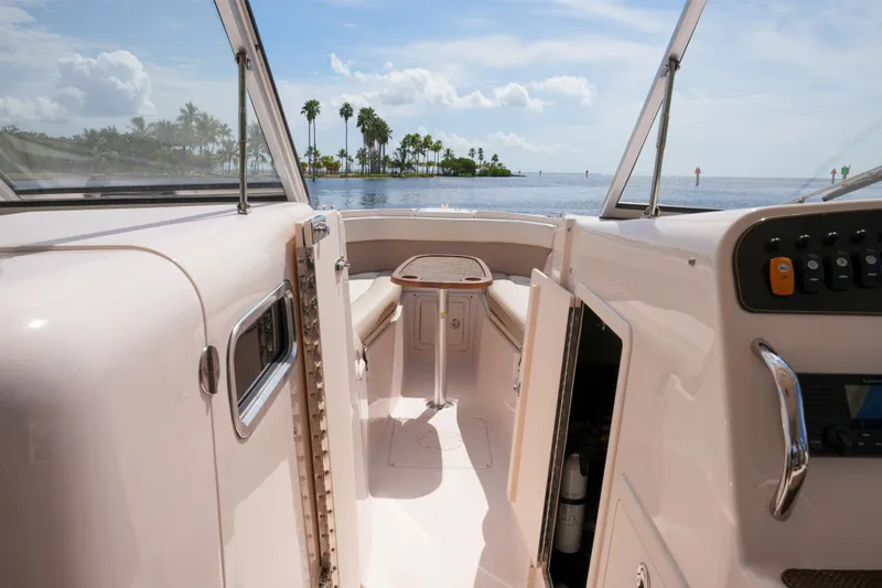  Yacht Photos Pics 2014 Grady-White Freedom 307 boat interior with ocean view and palm trees.
