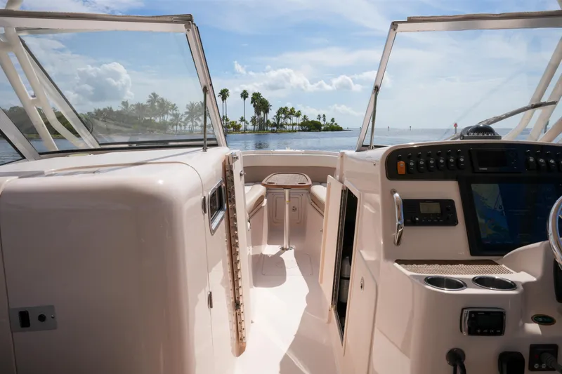  Yacht Photos Pics 2014 Grady-White Freedom 307 boat interior with ocean view and palm trees.