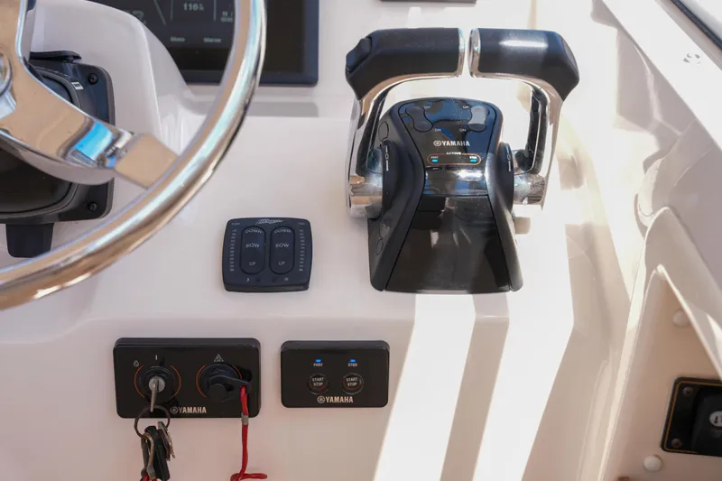  Yacht Photos Pics 2014 Grady-White Freedom 307 boat controls with Yamaha throttle and steering wheel.