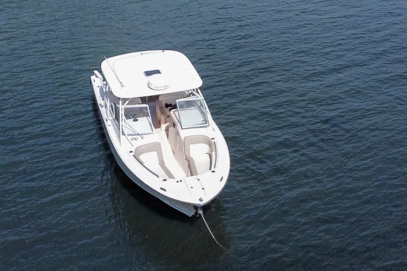  Yacht Photos Pics 2014 Grady-White Freedom 307 boat on calm water, aerial view.