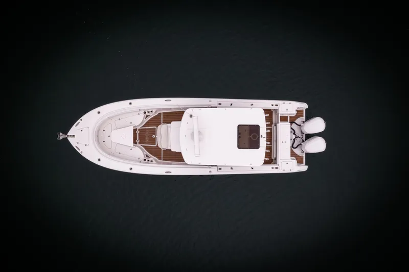 Pure Vida Yacht Photos Pics Aerial view of 2017 Edgewater Center Console boat on dark water.