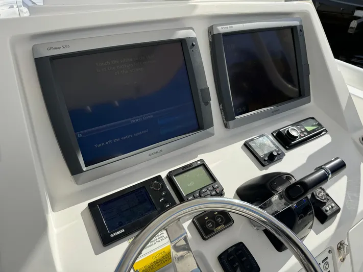 No Name Yacht Photos Pics 2014 Intrepid 327 Center Console dashboard with dual Garmin displays and navigation controls.