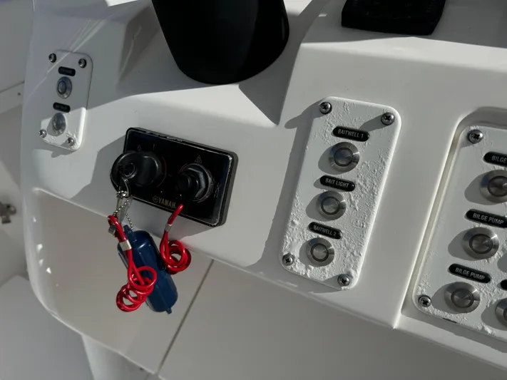 No Name Yacht Photos Pics Control panel of a 2014 Intrepid 327 Center Console boat with ignition keys.