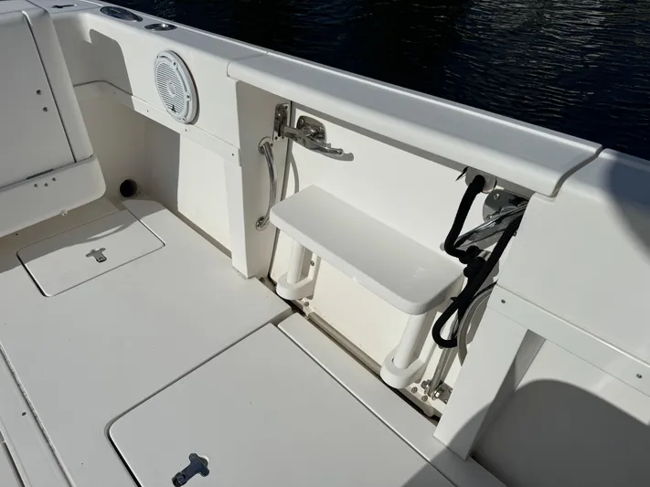 No Name Yacht Photos Pics 2014 Intrepid 327 Center Console boat interior with seating and storage compartments.