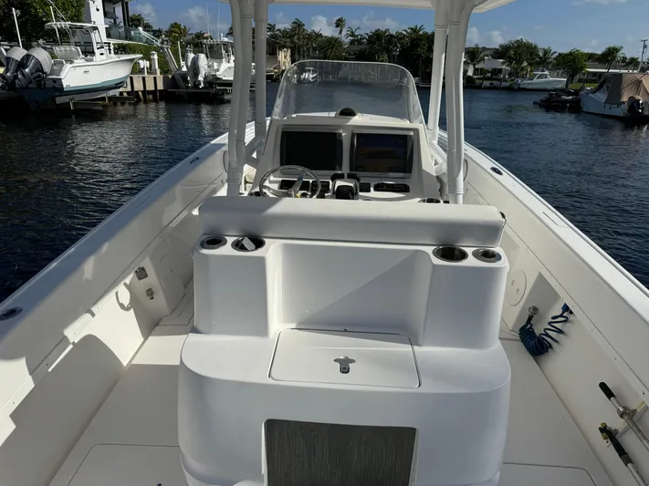 No Name Yacht Photos Pics 2014 Intrepid 327 Center Console boat on a calm waterway.