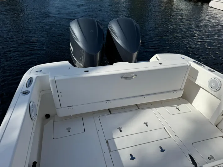 No Name Yacht Photos Pics 2014 Intrepid 327 Center Console boat with dual engines on calm water.