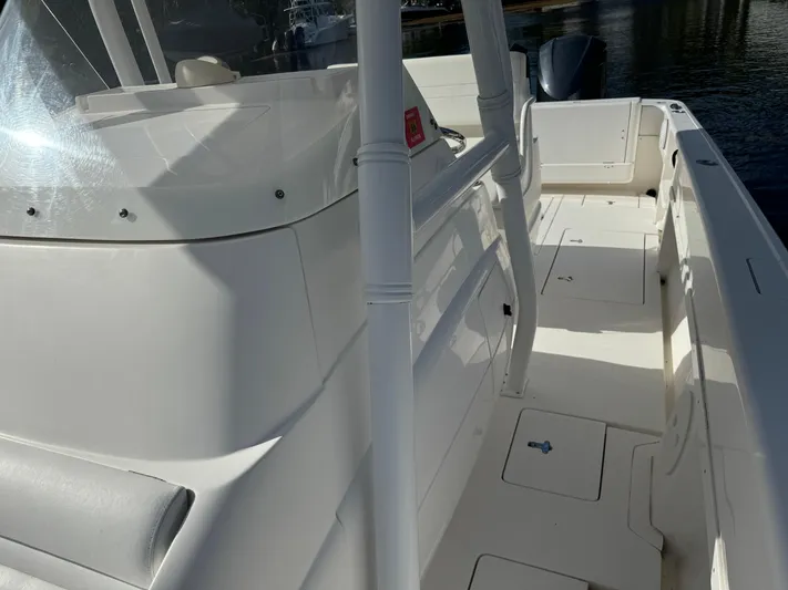 No Name Yacht Photos Pics 2014 Intrepid 327 Center Console boat with sleek white deck and seating.