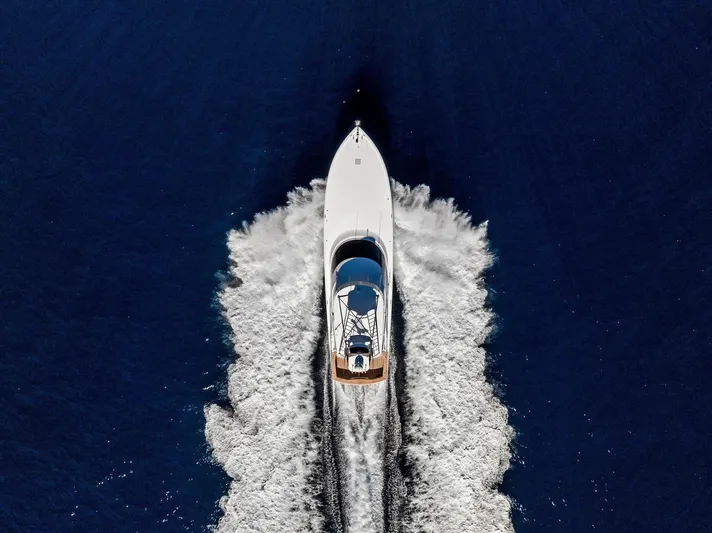  Yacht Photos Pics Aerial view of 2019 Viking 80 Convertible yacht cruising on open water.