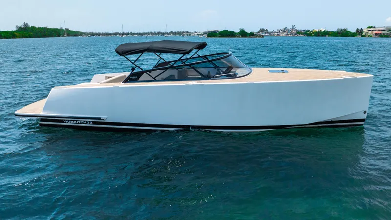  Yacht Photos Pics 2023 VanDutch 32 yacht on calm blue water, featuring sleek design and modern aesthetics.
