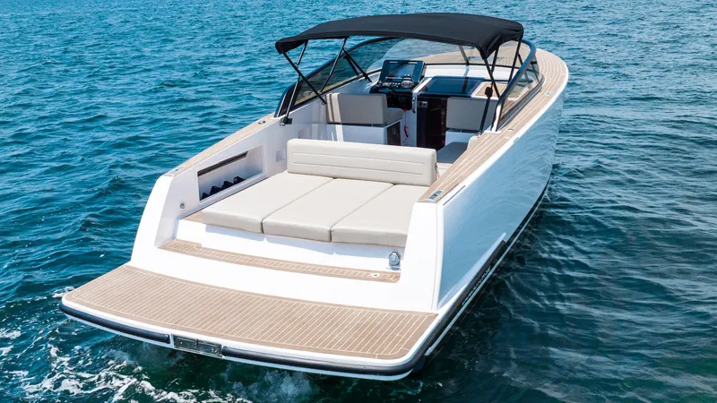  Yacht Photos Pics 2023 VanDutch 32 luxury yacht cruising on open water, featuring sleek design and spacious deck.