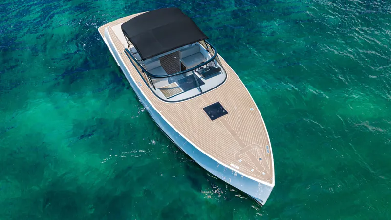  Yacht Photos Pics 2023 VanDutch 32 luxury yacht cruising on clear turquoise waters.