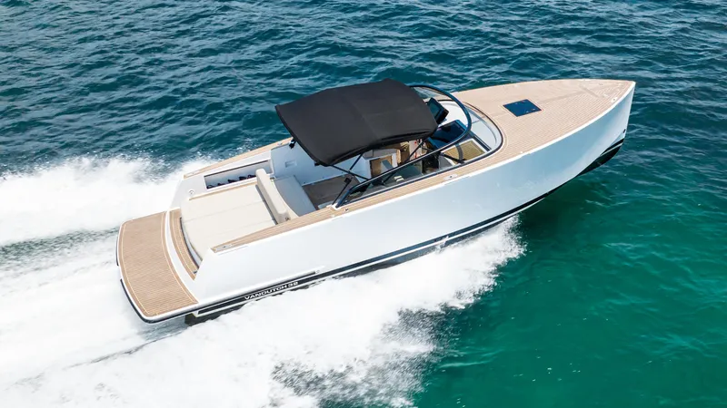  Yacht Photos Pics 2023 VanDutch 32 yacht cruising on clear blue ocean waters.