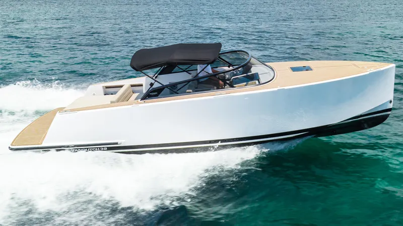  Yacht Photos Pics 2023 VanDutch 32 yacht cruising on clear blue water.