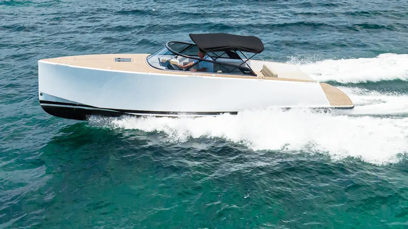  Yacht Photos Pics 2023 VanDutch 32 yacht cruising on open water, showcasing sleek design and luxury features.