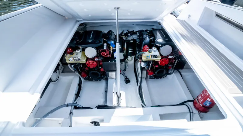  Yacht Photos Pics 2023 VanDutch 32 engine compartment with dual engines and fire extinguisher.