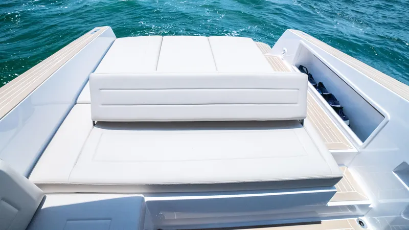  Yacht Photos Pics 2023 VanDutch 32 yacht with luxurious white seating on open water.