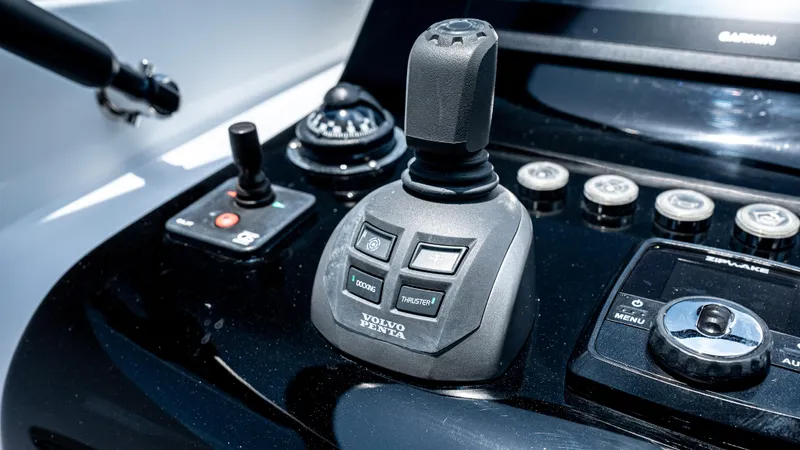  Yacht Photos Pics Control panel of 2023 VanDutch 32 yacht featuring Volvo Penta joystick and navigation controls.