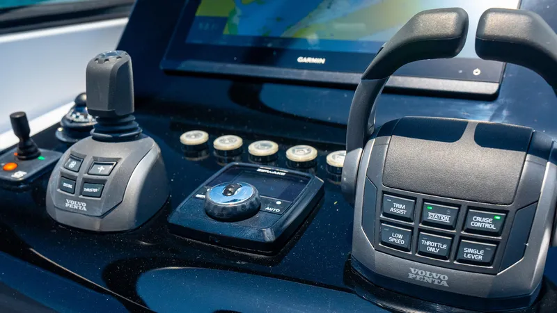  Yacht Photos Pics Control panel of 2023 VanDutch 32 yacht featuring advanced navigation and throttle systems.