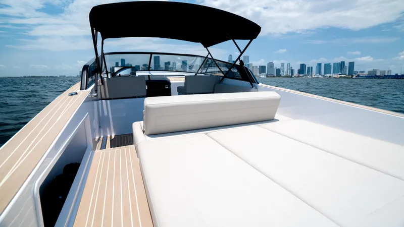  Yacht Photos Pics VanDutch 32 yacht, 2023 model, cruising with city skyline in background.
