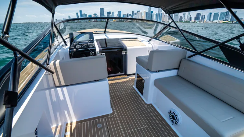 Yacht Photos Pics VanDutch 32 yacht interior with city skyline, 2023 model, featuring sleek seating and modern design.